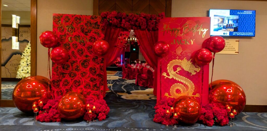 red birthday decorations, roses, dragons, flowers, entrance